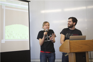 Michele with a stupid face and Shawn looking happy presenting our work at the designathon