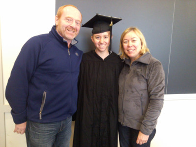Graduation photo with mom and dad